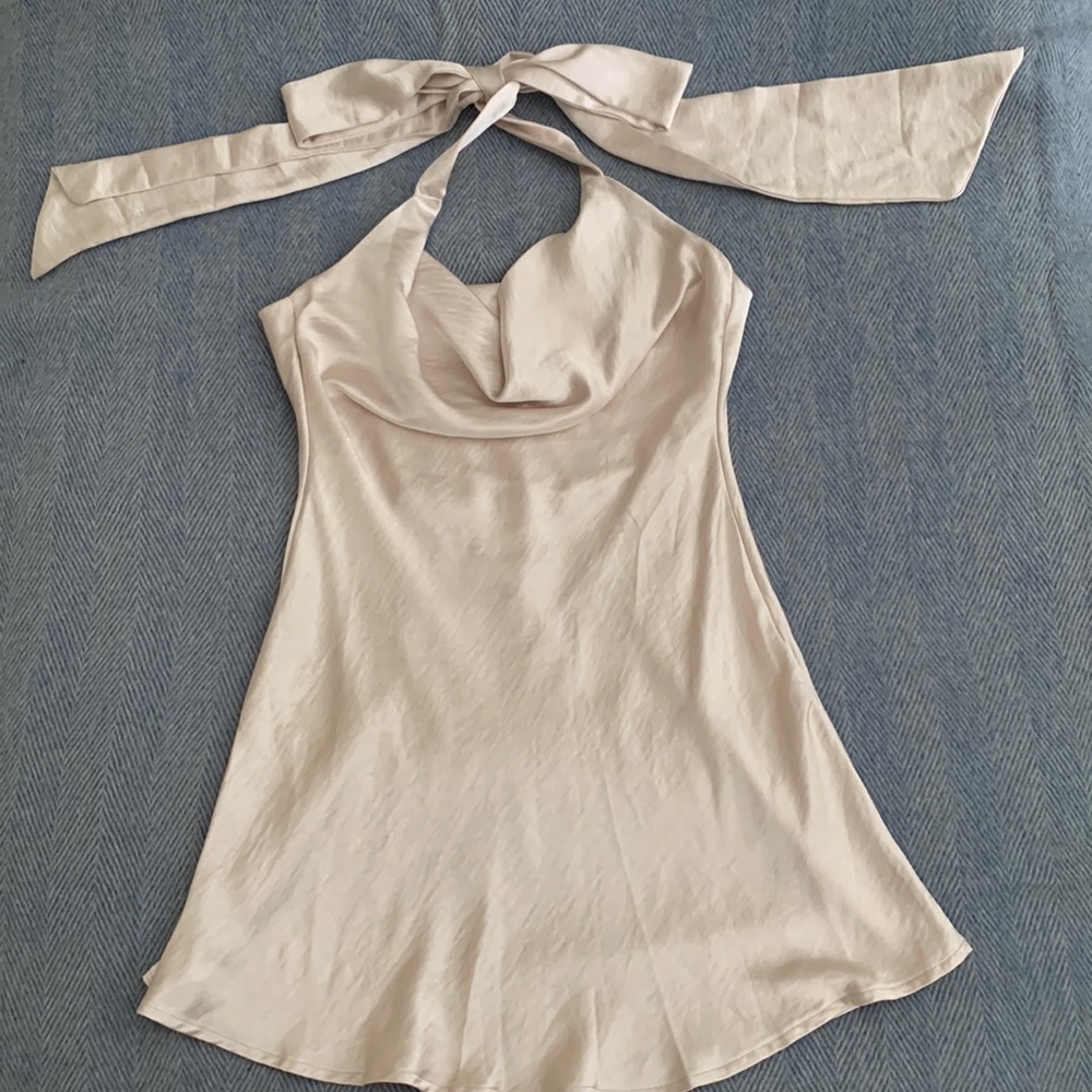 The model is shown in the dress in another color. Only worn once.
